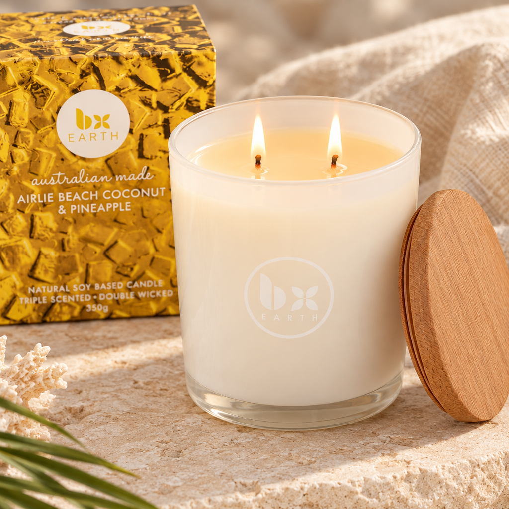 Close-up of the double-wicked Airlie Beach coconut and pineapple candle burning